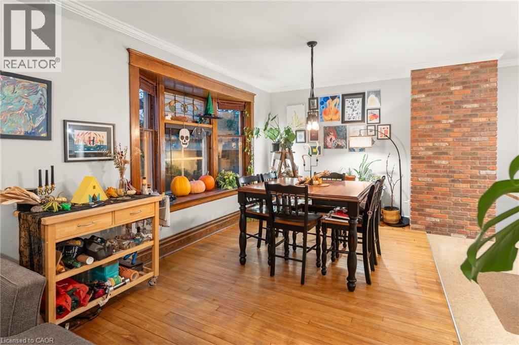 Dining area featuring hardwood / wood-style flooring and ornamental molding - 58 Hohner Avenue, Kitchener, ON - Indoor Photo Showing Dining Room