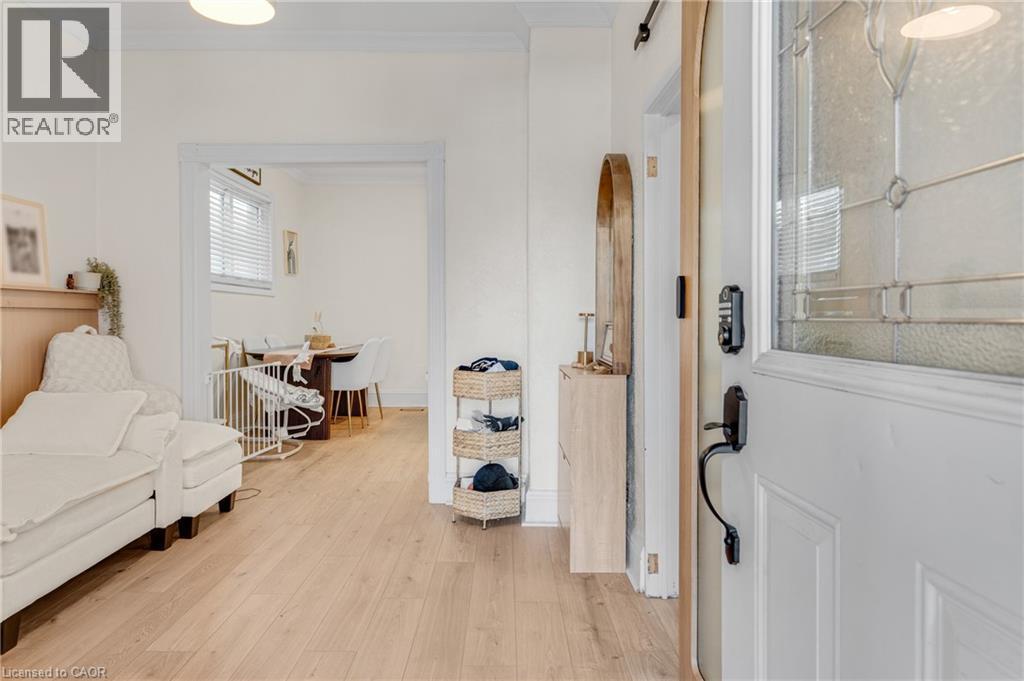 Foyer with light wood finished floors, crown molding, and arched walkways - 6 Ben Lomond Place, Hamilton, ON - Indoor