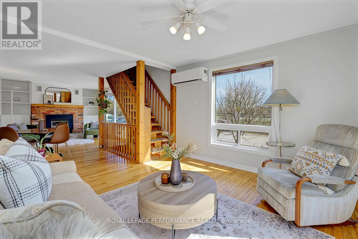 1141 North River Road, Ottawa, ON - Indoor Photo Showing Living Room With Fireplace