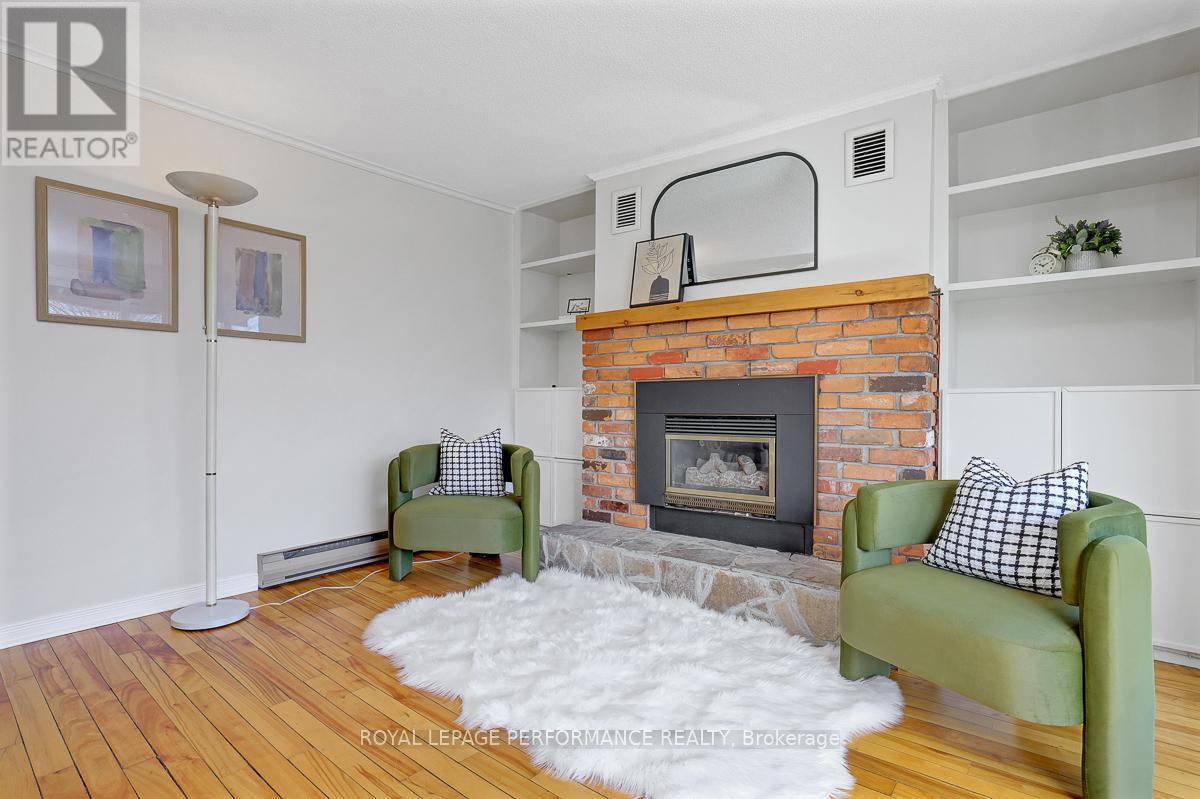 1141 North River Road, Ottawa, ON - Indoor Photo Showing Living Room With Fireplace