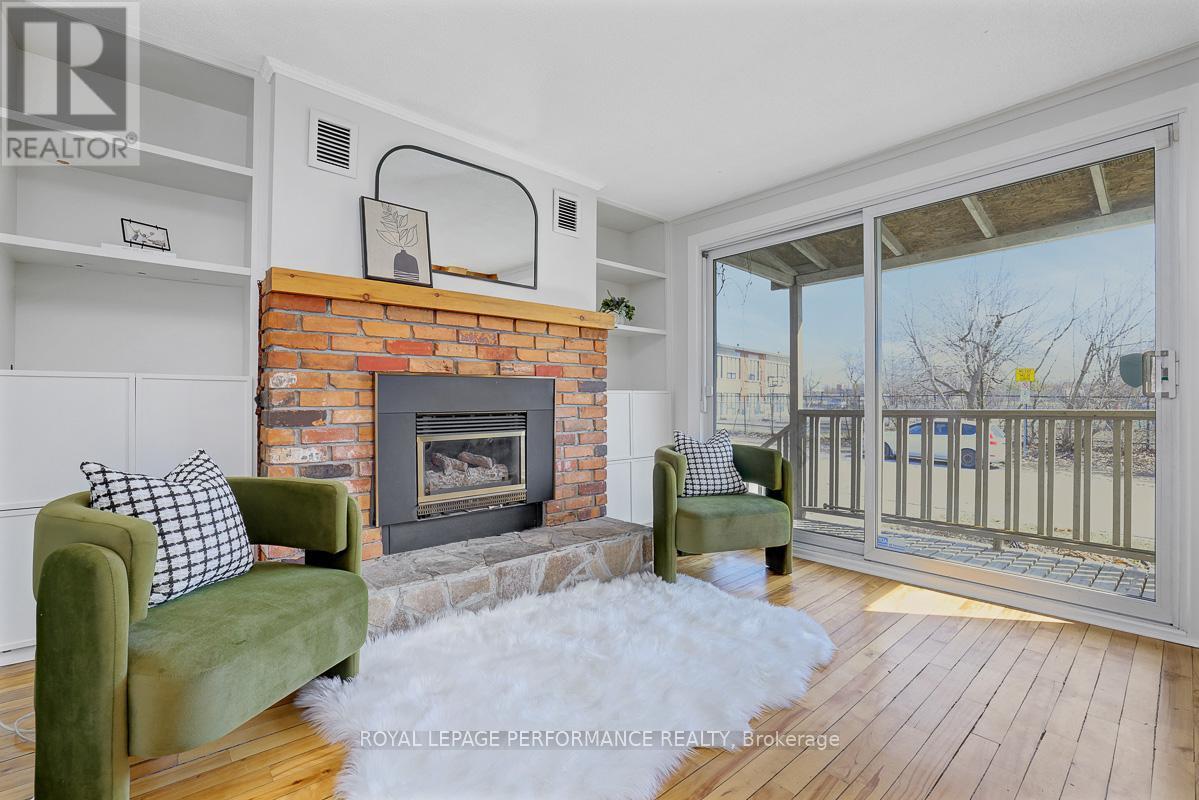 1141 North River Road, Ottawa, ON - Indoor Photo Showing Living Room With Fireplace