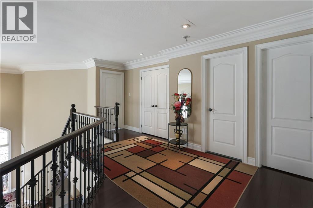 Hall with an upstairs landing, ornamental molding, dark wood-style floors, and recessed lighting - 254 Rymal Road W, Hamilton, ON - Indoor Photo Showing Other Room