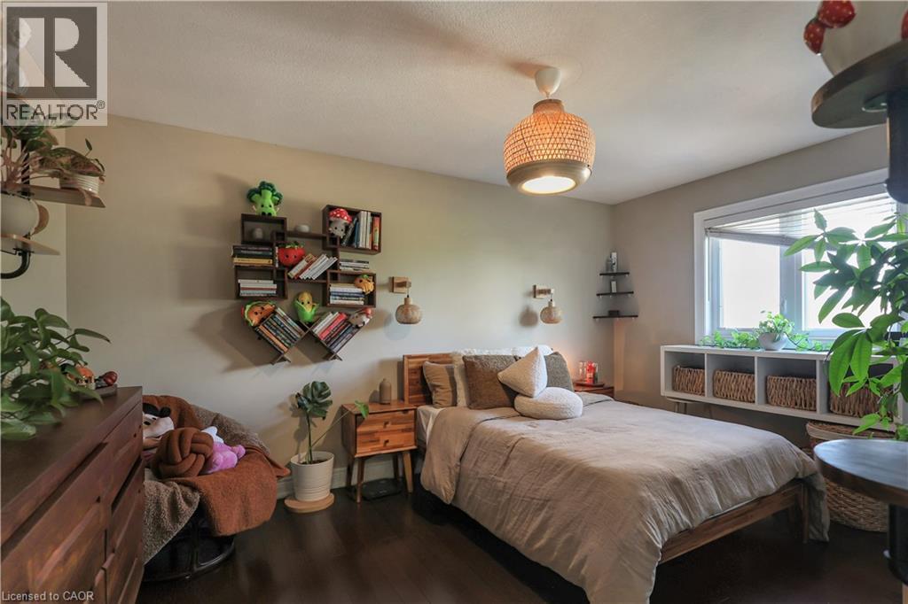 Bedroom featuring dark wood-style flooring - 254 Rymal Road W, Hamilton, ON - Indoor Photo Showing Bedroom