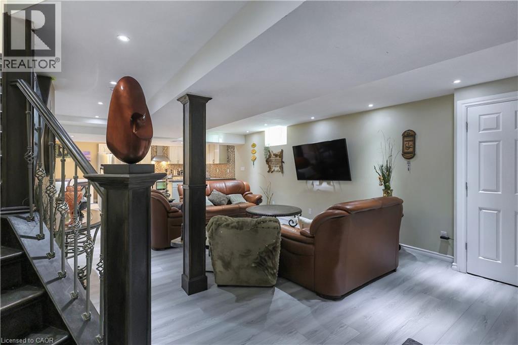 Living area with wood finished floors and recessed lighting - 254 Rymal Road W, Hamilton, ON - Indoor