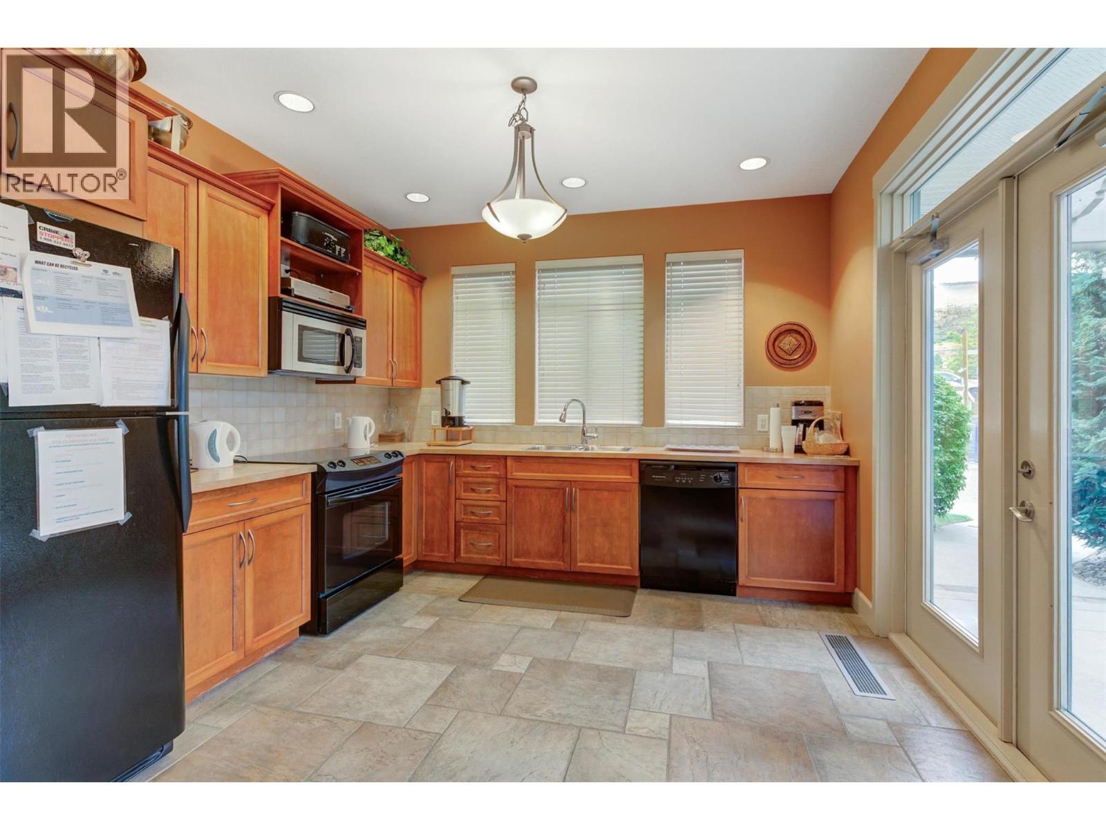 Clubhouse Kitchen - 4035 Gellatly Road S Unit# 273, West Kelowna, BC - Indoor Photo Showing Kitchen With Double Sink