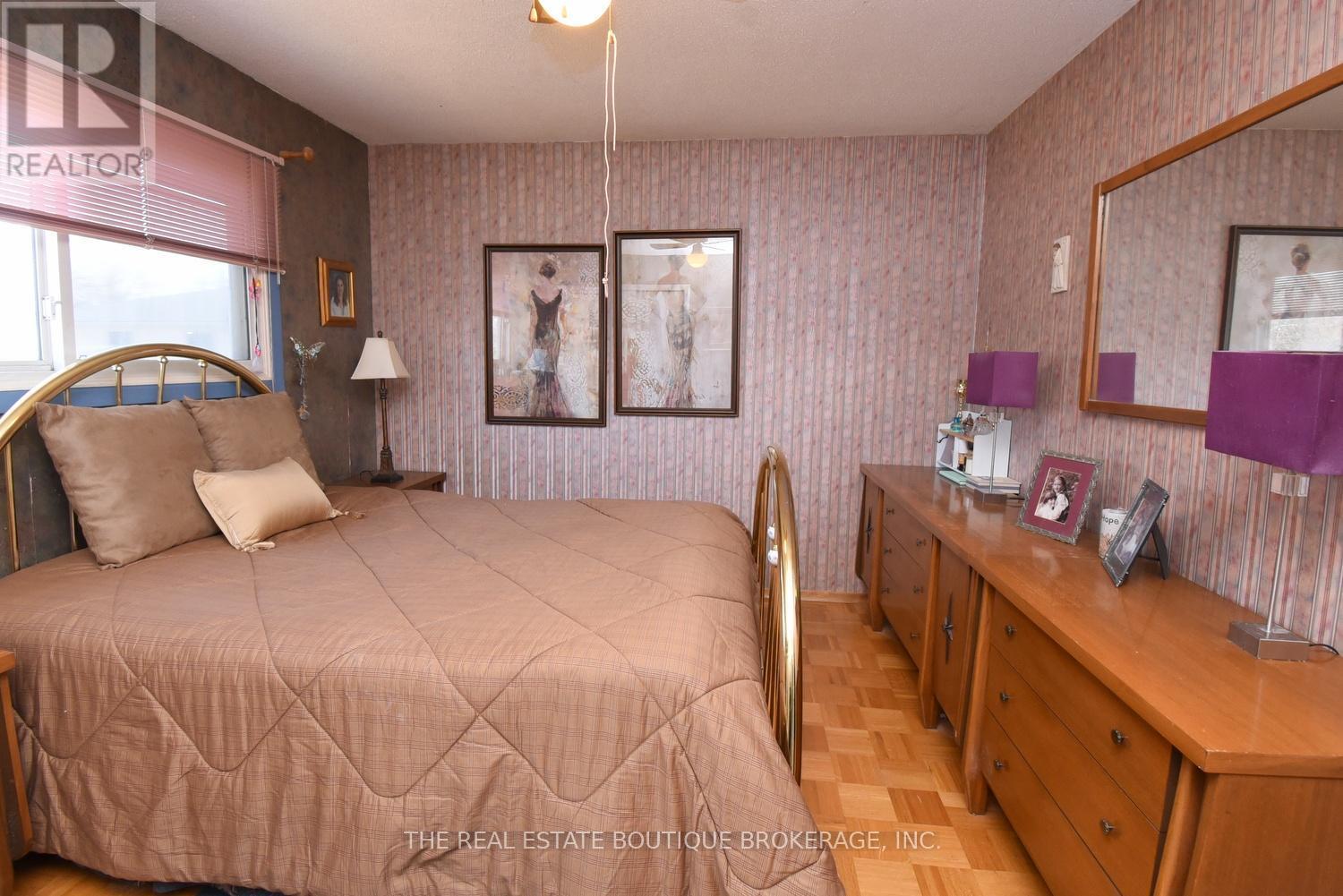 Primary Bedroom featuring parquet flooring - 1345 Colonsay Drive, Burlington, ON