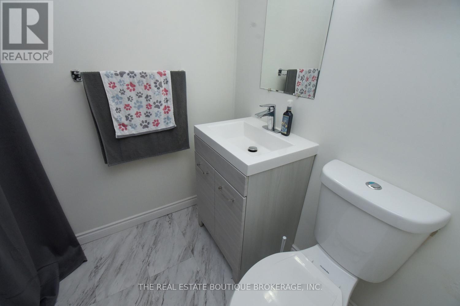Beautifully updated 2pc Bathroom in basement - 1345 Colonsay Drive, Burlington, ON