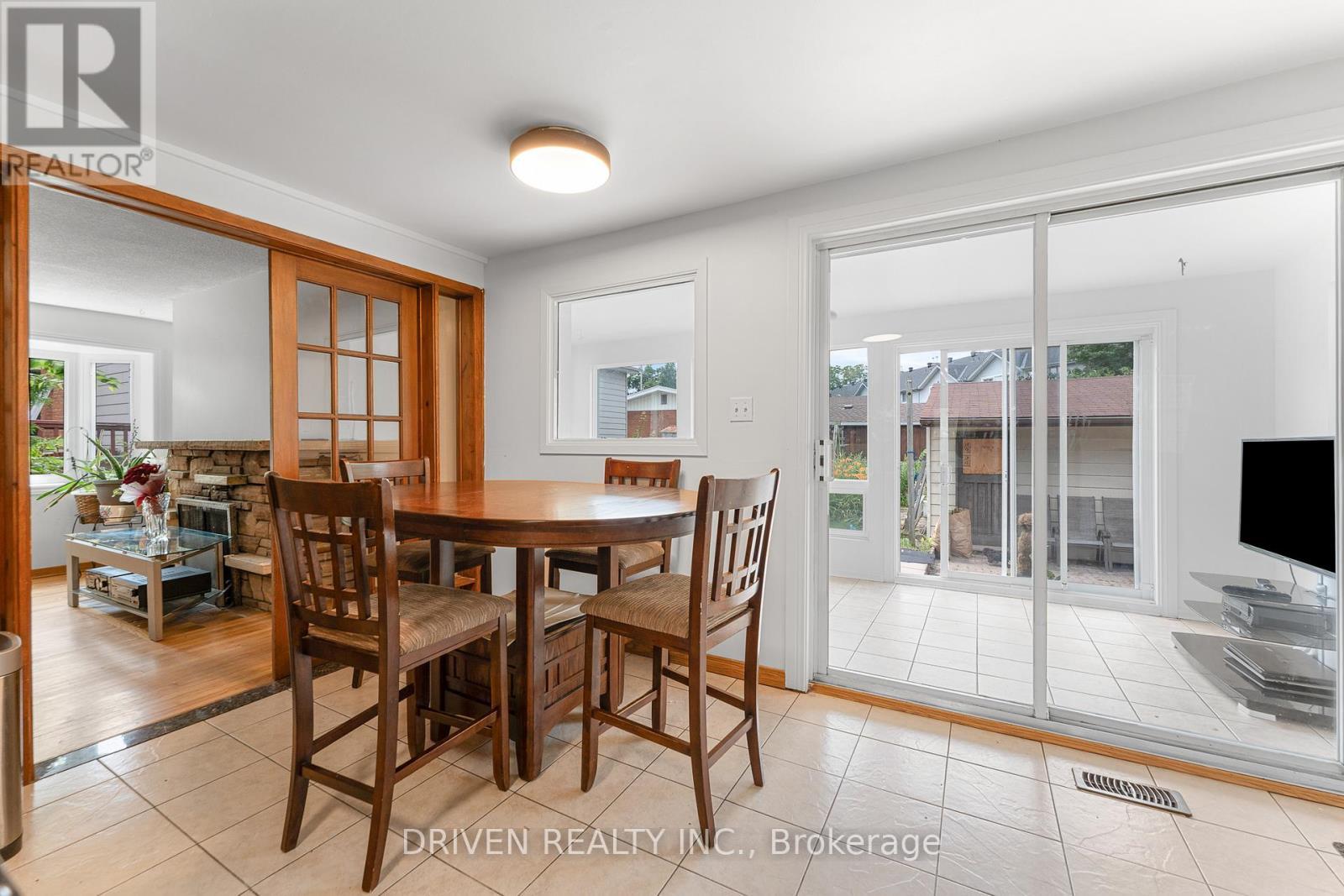 Eating space leading into sun-filled bonus room. - 876 Pinecrest Road, Ottawa, ON - Indoor Photo Showing Dining Room