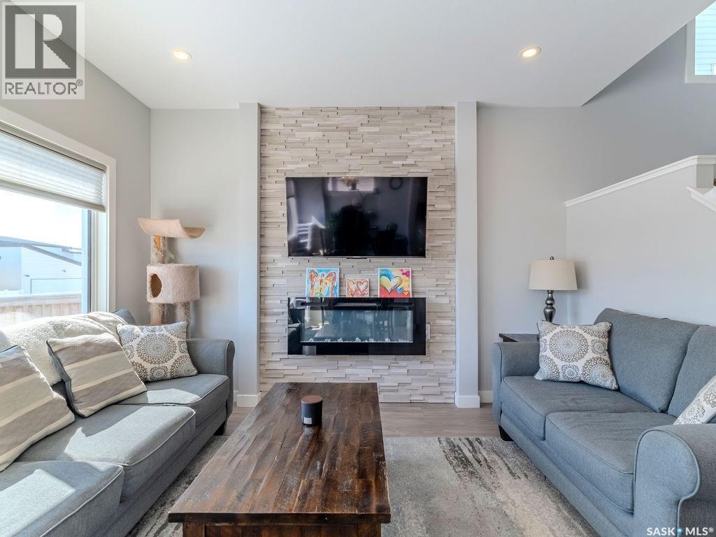 114 Germain Court, Saskatoon, SK - Indoor Photo Showing Living Room With Fireplace