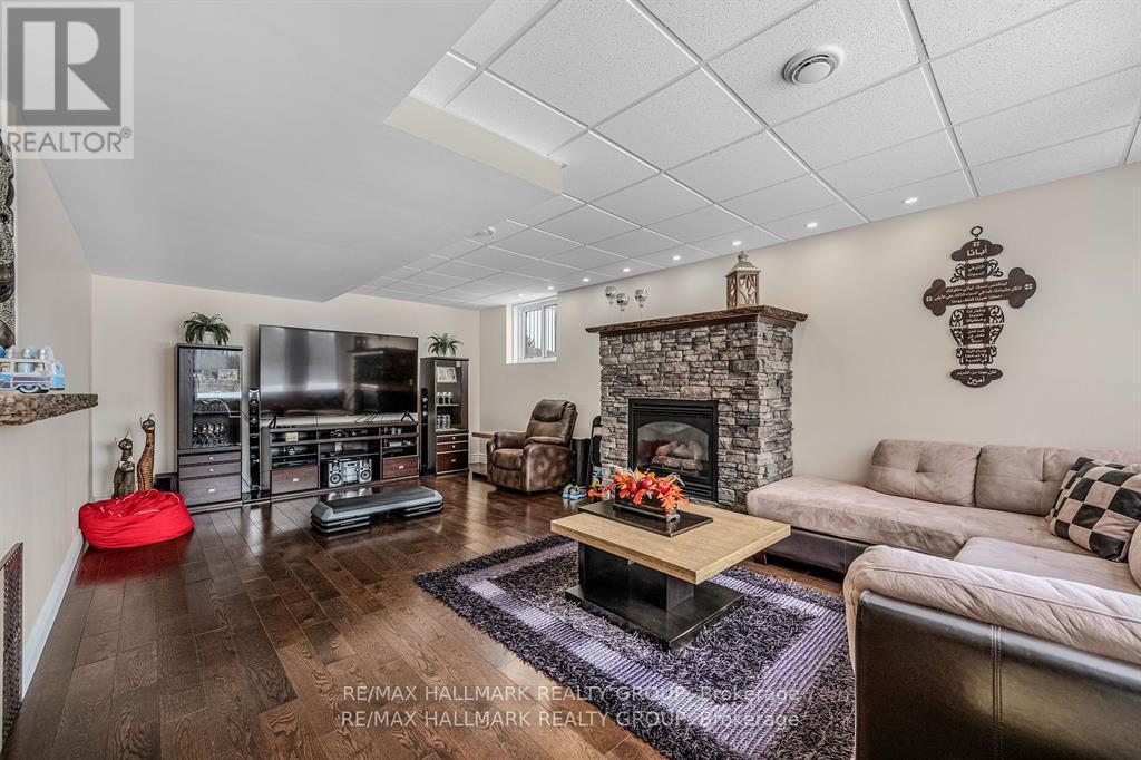 699 Ballycastle Crescent, Ottawa, ON - Indoor Photo Showing Living Room With Fireplace
