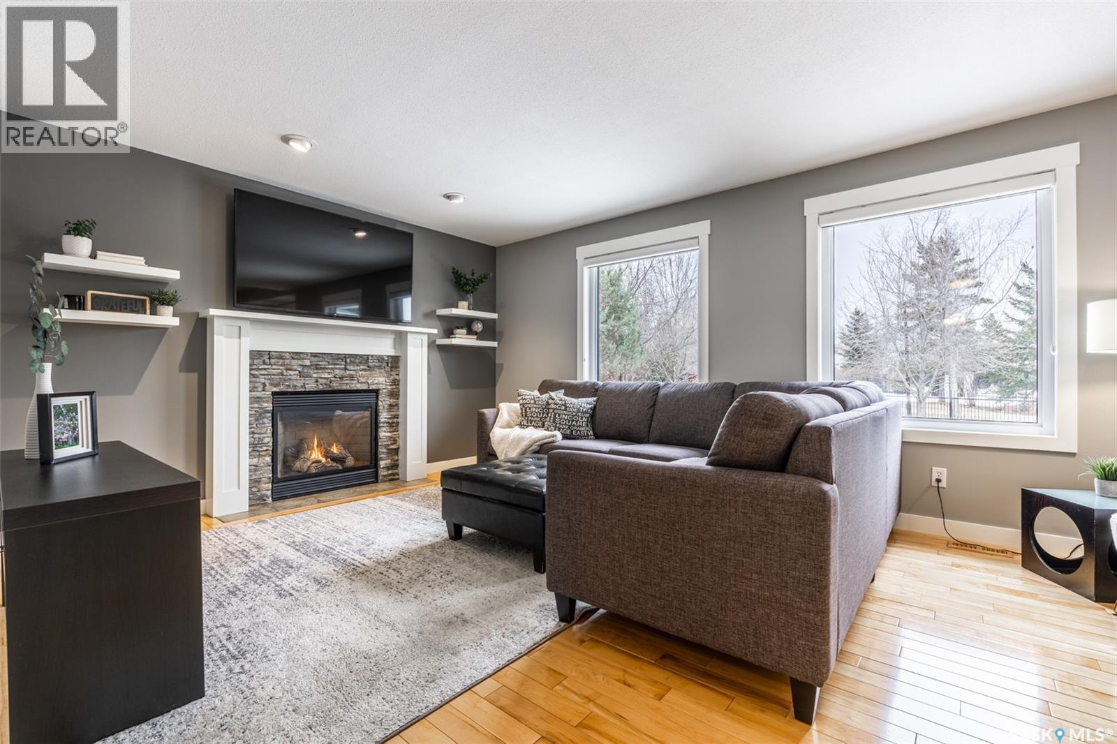922 Budz Green, Saskatoon, SK - Indoor Photo Showing Living Room With Fireplace