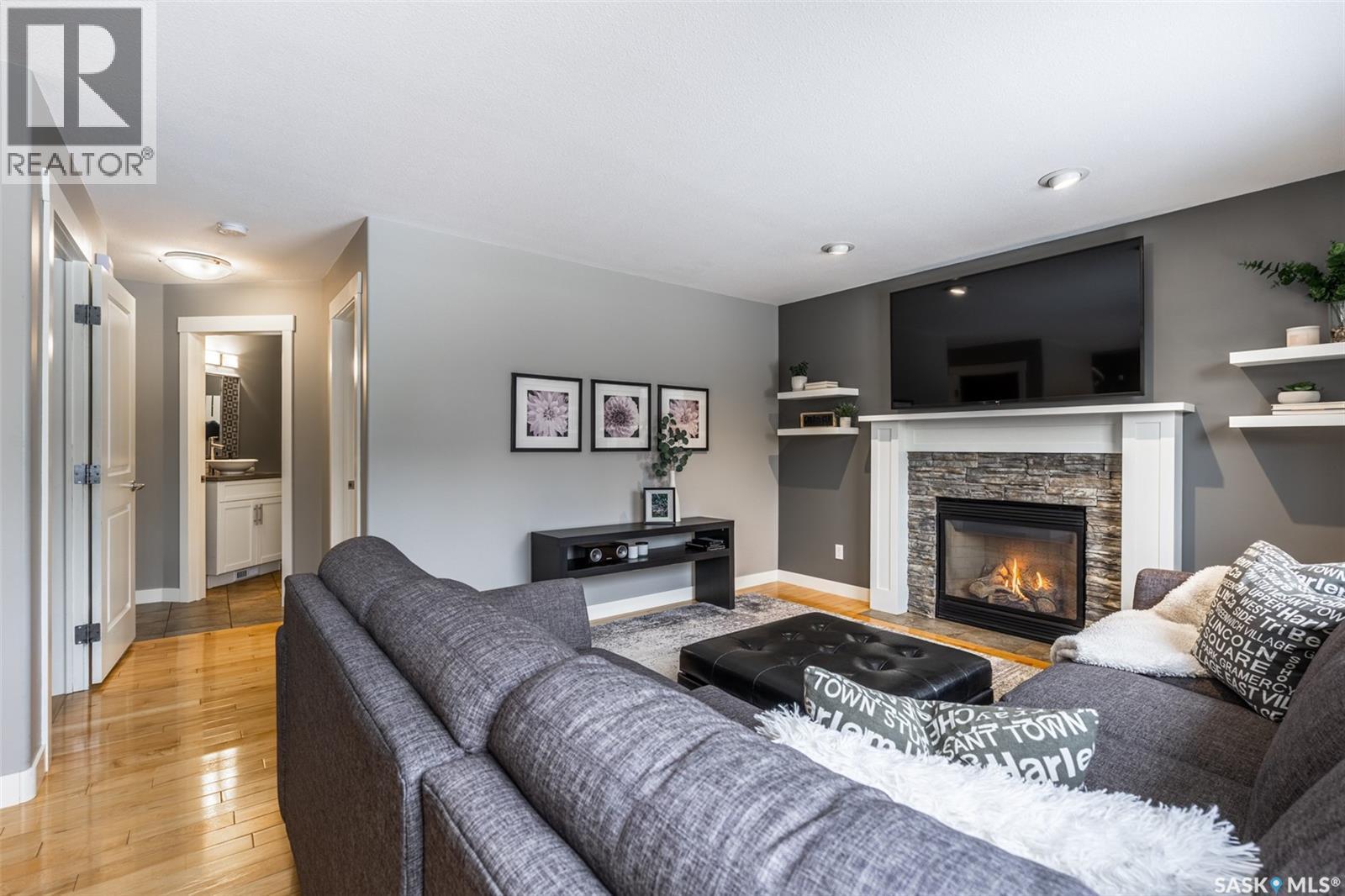 922 Budz Green, Saskatoon, SK - Indoor Photo Showing Living Room With Fireplace