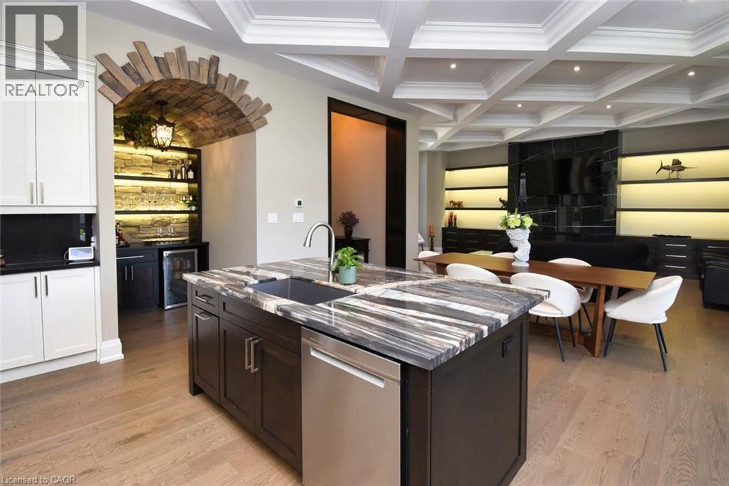 Two tone kitchen featuring stainless steel dishwasher, coffered ceiling, an island with sink, beverage cooler, and recessed lighting - 68 Mountain Brow Boulevard, Hamilton, ON - Indoor Photo Showing Kitchen With Upgraded Kitchen