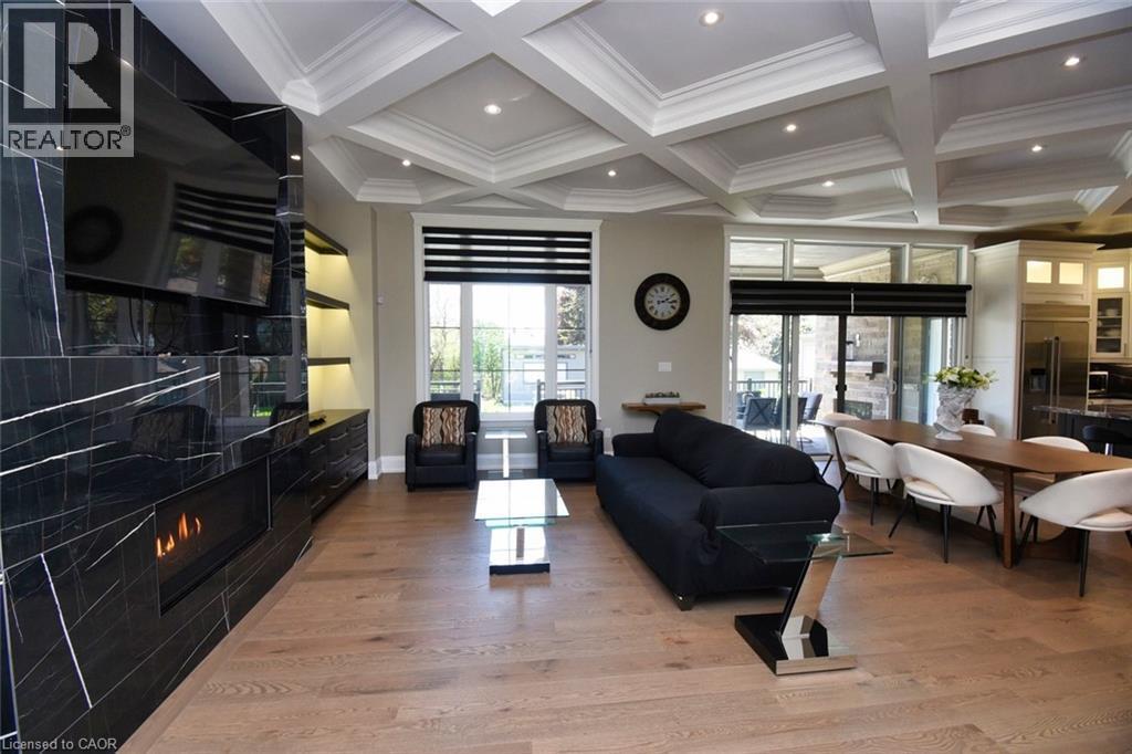 Living area with coffered ceiling, light wood-type flooring, recessed lighting, ornamental molding, and a high end fireplace - 68 Mountain Brow Boulevard, Hamilton, ON - Indoor Photo Showing Living Room