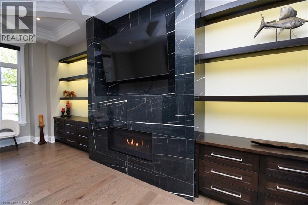 Detailed view of coffered ceiling, wood finished floors, ornamental molding, a high end fireplace, and recessed lighting - 68 Mountain Brow Boulevard, Hamilton, ON - Indoor Photo Showing Other Room