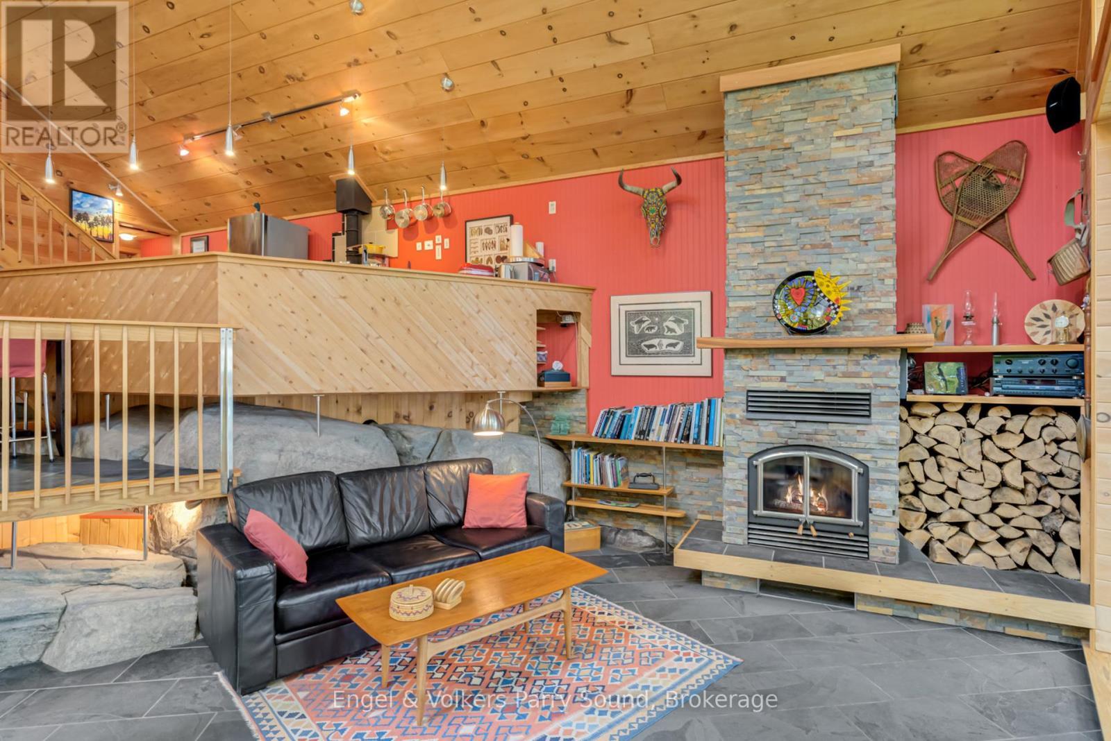 139 Manitou Drive, Mckellar, ON - Indoor Photo Showing Living Room With Fireplace