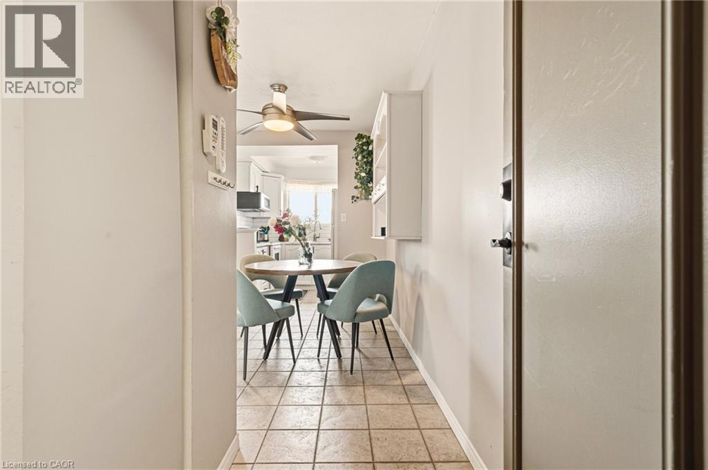 Dining room with ceiling fan and light tile patterned floors - 2373 E King Street E Unit# 45, Hamilton, ON - Indoor
