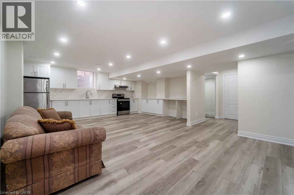 Living room with light wood-type flooring and recessed lighting - 150 Goodwin Crescent Unit# Bsmt, Milton, ON - Indoor