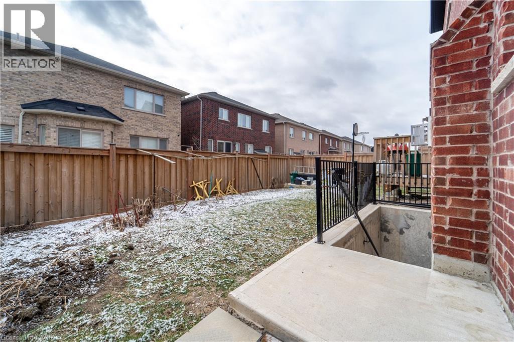 Fenced yard with a patio area - 150 Goodwin Crescent Unit# Bsmt, Milton, ON - Outdoor
