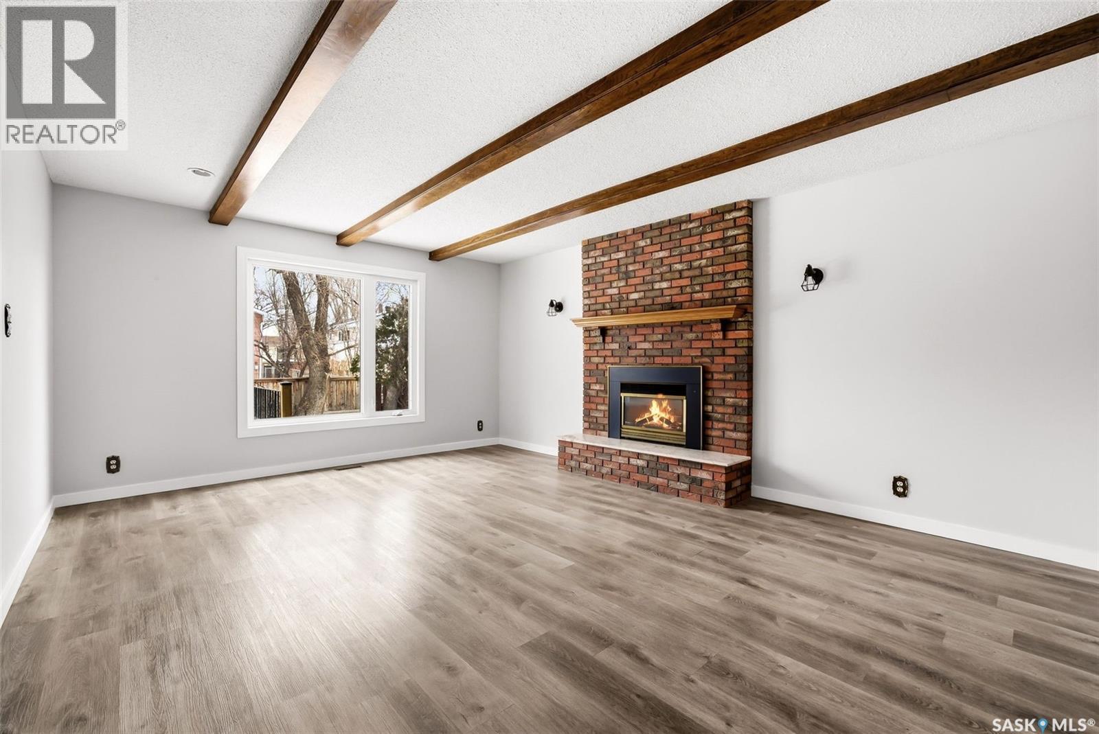 30 Dalhousie Way, Regina, SK - Indoor Photo Showing Living Room With Fireplace