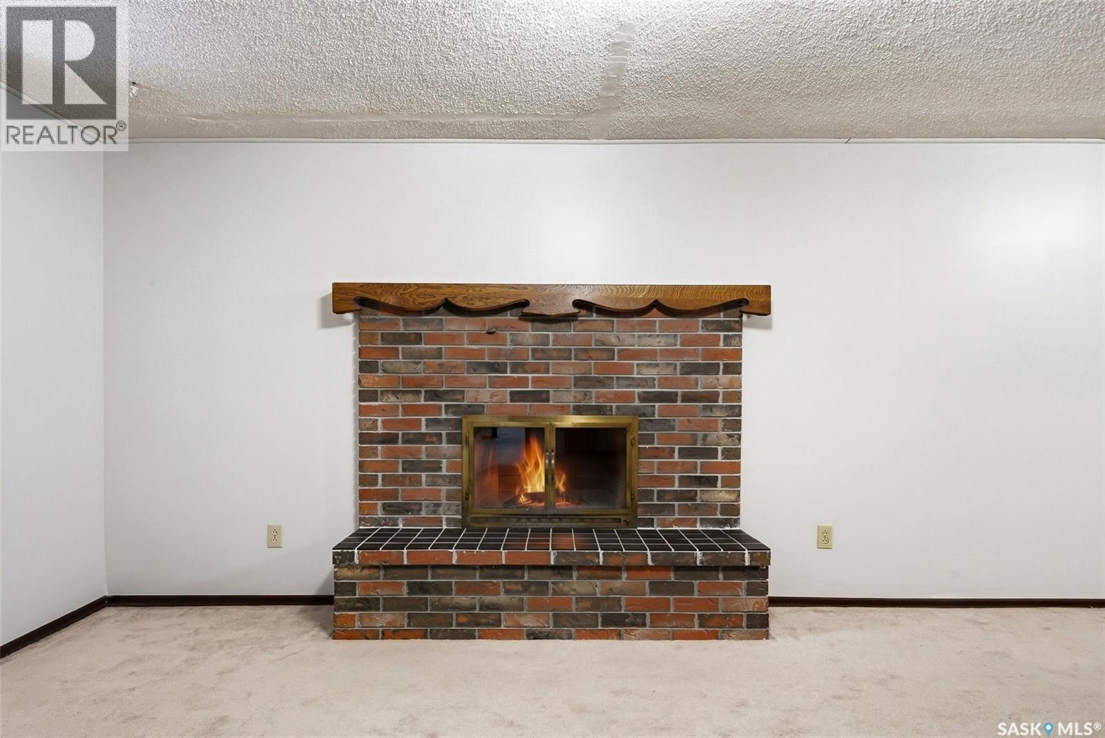 30 Dalhousie Way, Regina, SK - Indoor With Fireplace