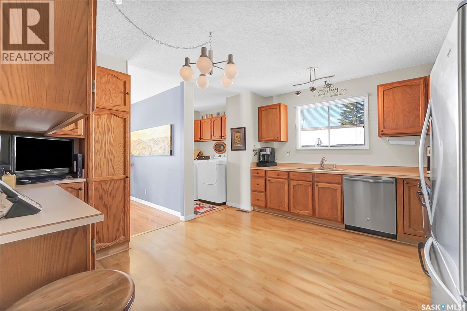 703 Candle Court, Saskatoon, SK - Indoor Photo Showing Kitchen With Double Sink