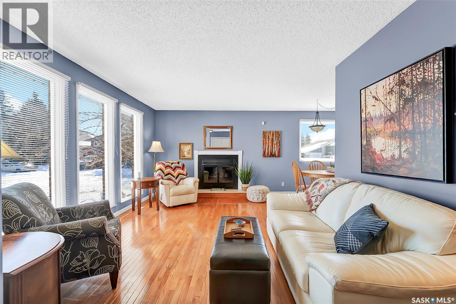 703 Candle Court, Saskatoon, SK - Indoor Photo Showing Living Room With Fireplace