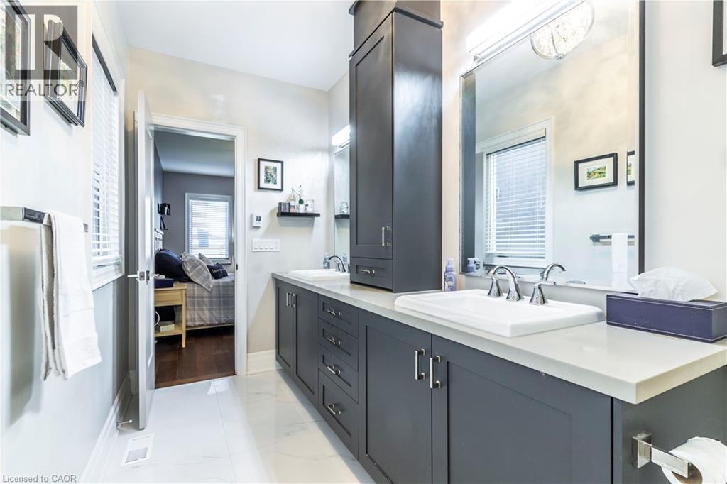 Bathroom with double vanity, ensuite bathroom, and light marble finish flooring - 72 Pond View Gate, Waterdown, ON - Indoor Photo Showing Bathroom