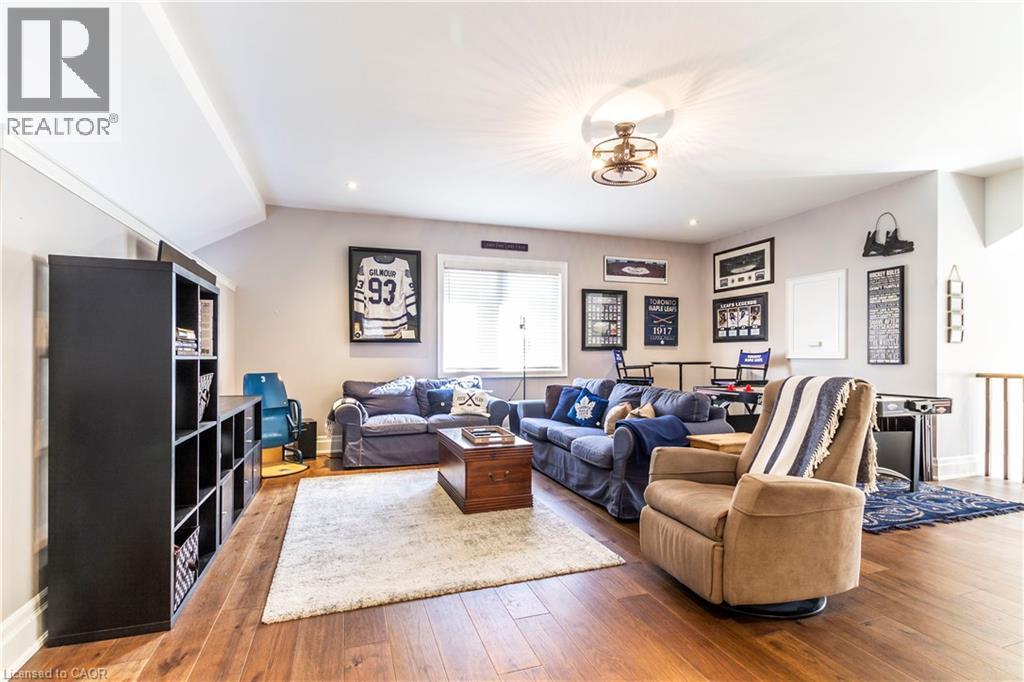 Living room featuring hardwood / wood-style flooring and recessed lighting - 72 Pond View Gate, Waterdown, ON - Indoor Photo Showing Living Room