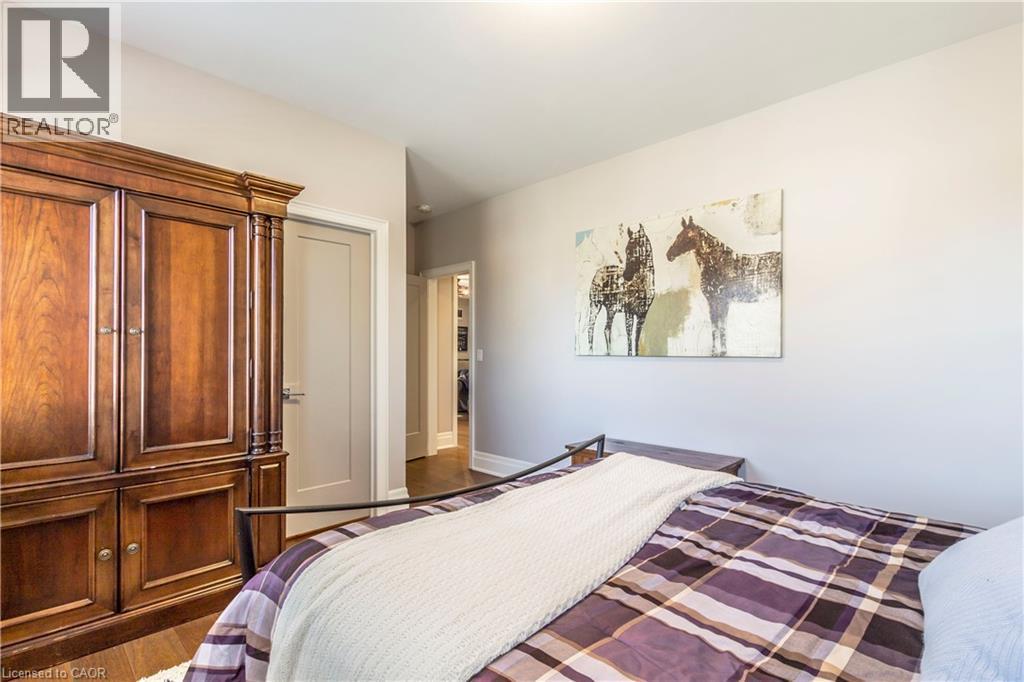 Bedroom featuring wood finished floors - 72 Pond View Gate, Waterdown, ON - Indoor Photo Showing Bedroom