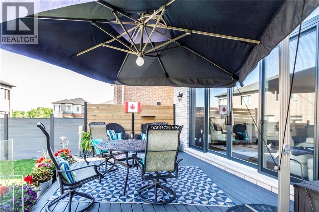 Wooden deck with outdoor dining space - 72 Pond View Gate, Waterdown, ON - Outdoor With Deck Patio Veranda With Exterior