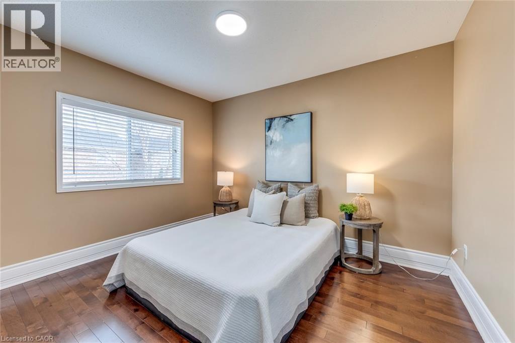 Bedroom featuring dark wood-style floors - 5811 Page Crescent, Burlington, ON - Indoor Photo Showing Bedroom
