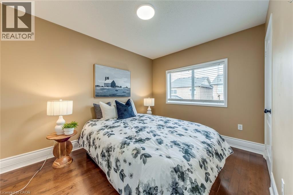 Bedroom featuring baseboards and dark wood-style floors - 5811 Page Crescent, Burlington, ON - Indoor Photo Showing Bedroom