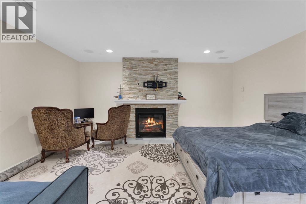 3921 Zanzibar Crescent, Windsor, ON - Indoor Photo Showing Bedroom With Fireplace