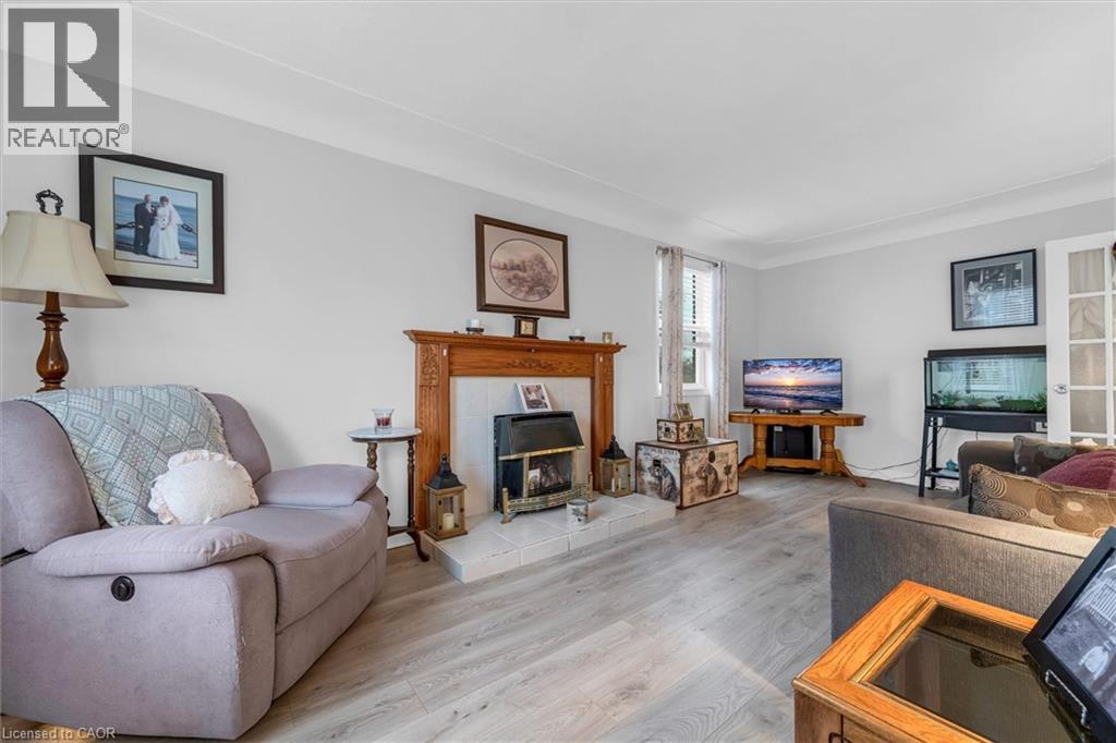 143 Walter Avenue S, Hamilton, ON - Indoor Photo Showing Living Room With Fireplace