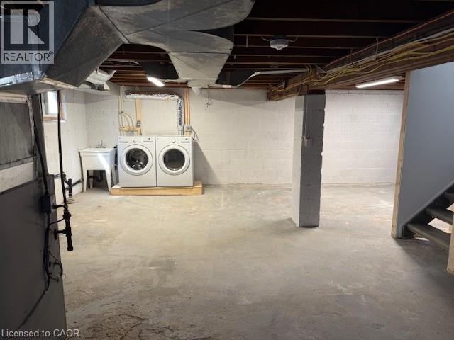 Unfinished basement with separate washer and dryer and heating unit - 322 Upper Gage Avenue, Hamilton, ON - Indoor