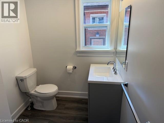 Bathroom with vanity and dark wood-style floors - 322 Upper Gage Avenue, Hamilton, ON - Indoor Photo Showing Bathroom