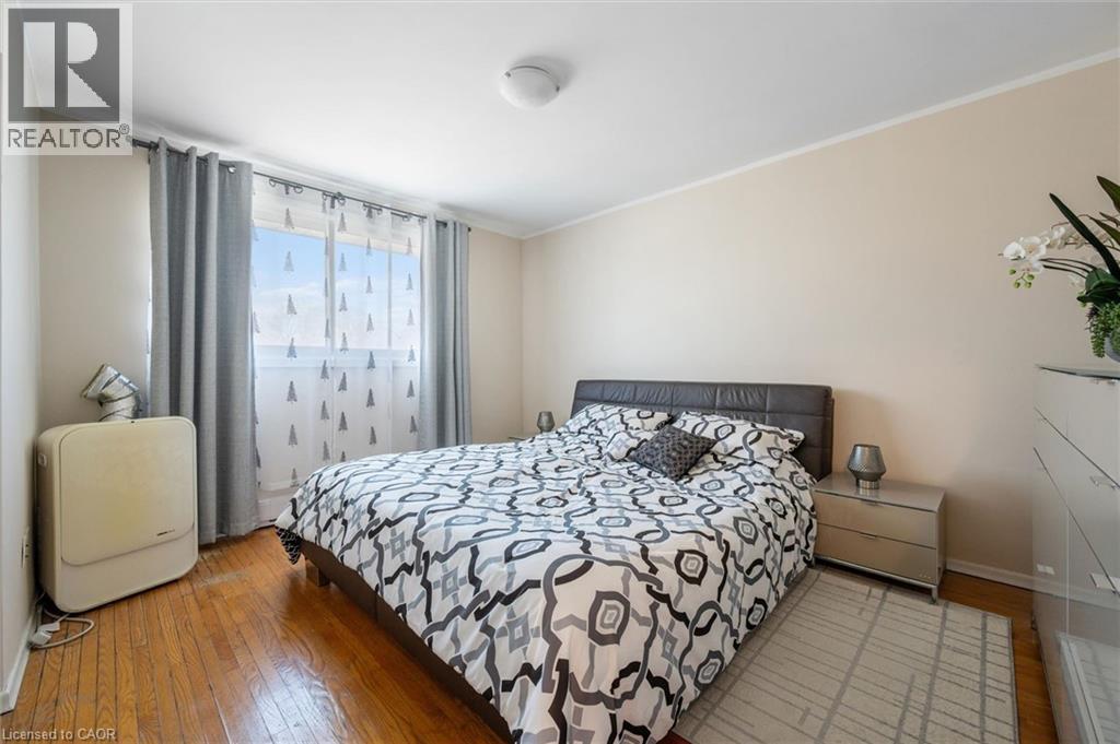 Bedroom with light wood-type flooring and crown molding - 55 Ralgreen Crescent, Kitchener, ON - Indoor Photo Showing Bedroom
