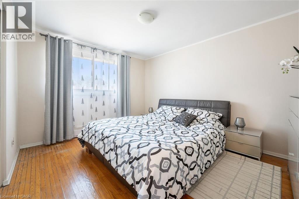 Bedroom featuring light wood-style flooring and ornamental molding - 55 Ralgreen Crescent, Kitchener, ON - Indoor Photo Showing Bedroom