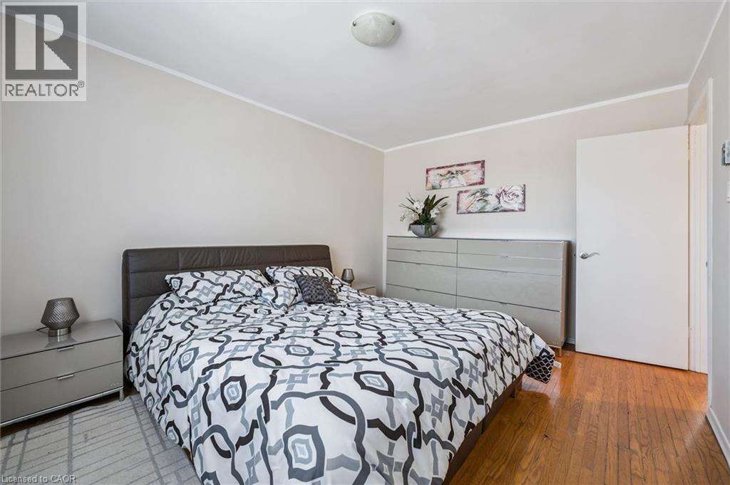 Bedroom with ornamental molding and light wood-type flooring - 55 Ralgreen Crescent, Kitchener, ON - Indoor Photo Showing Bedroom