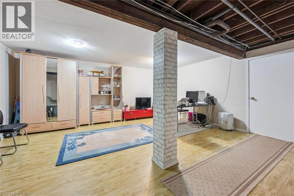 Finished below grade area with light wood finished floors - 55 Ralgreen Crescent, Kitchener, ON - Indoor