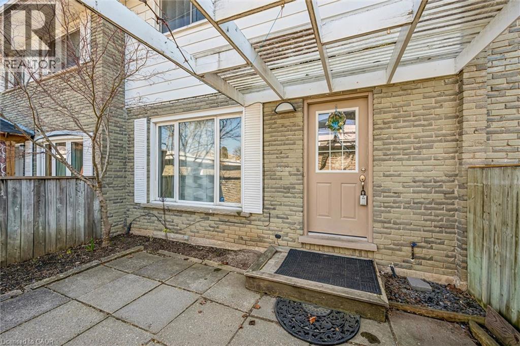 Entrance to property featuring a patio and brick siding - 55 Ralgreen Crescent, Kitchener, ON - Photo Showing Other Room