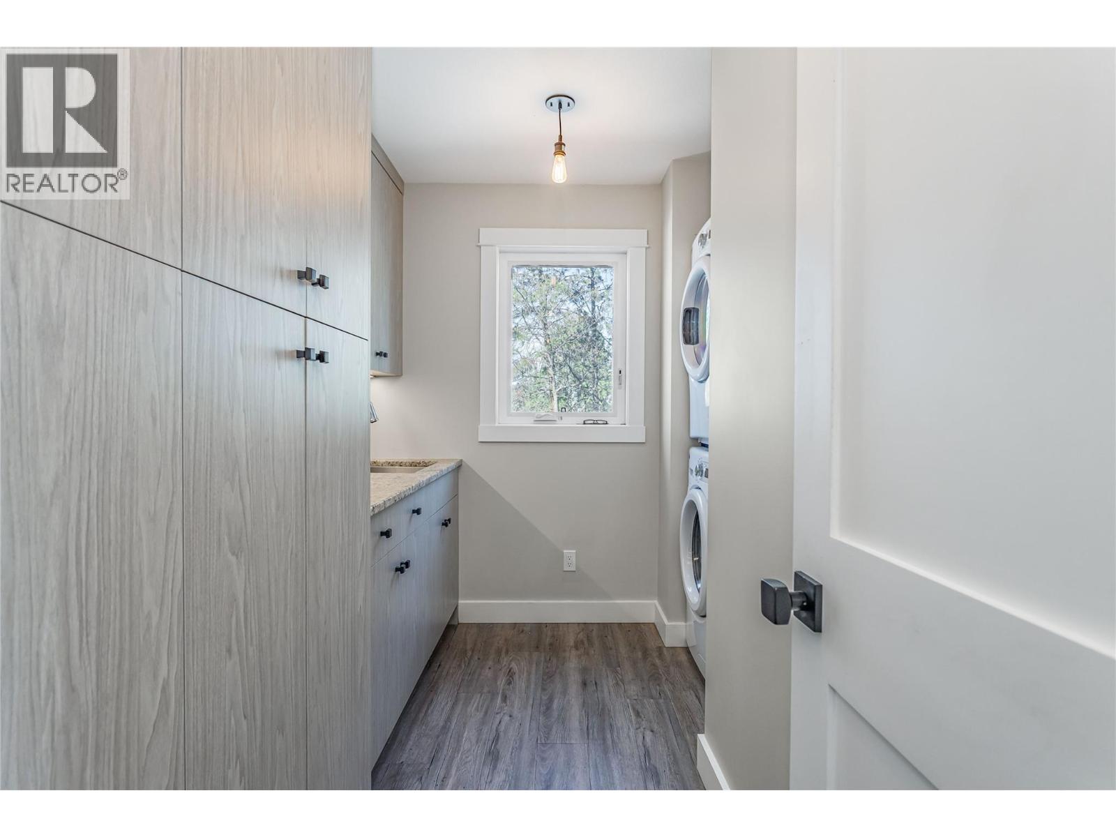 Laundry room and storage - 488 Sheila Crescent, Kelowna, BC - Indoor Photo Showing Other Room