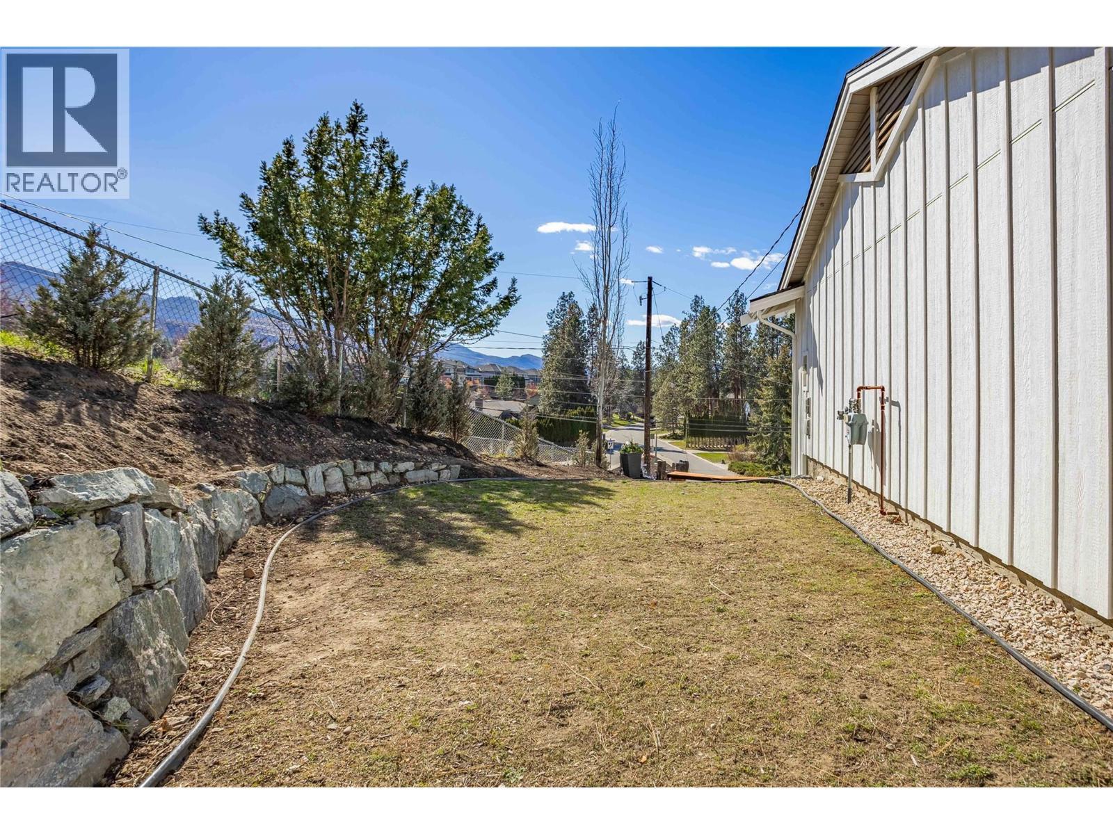 Side of house with Flat yard area. - 488 Sheila Crescent, Kelowna, BC - Outdoor