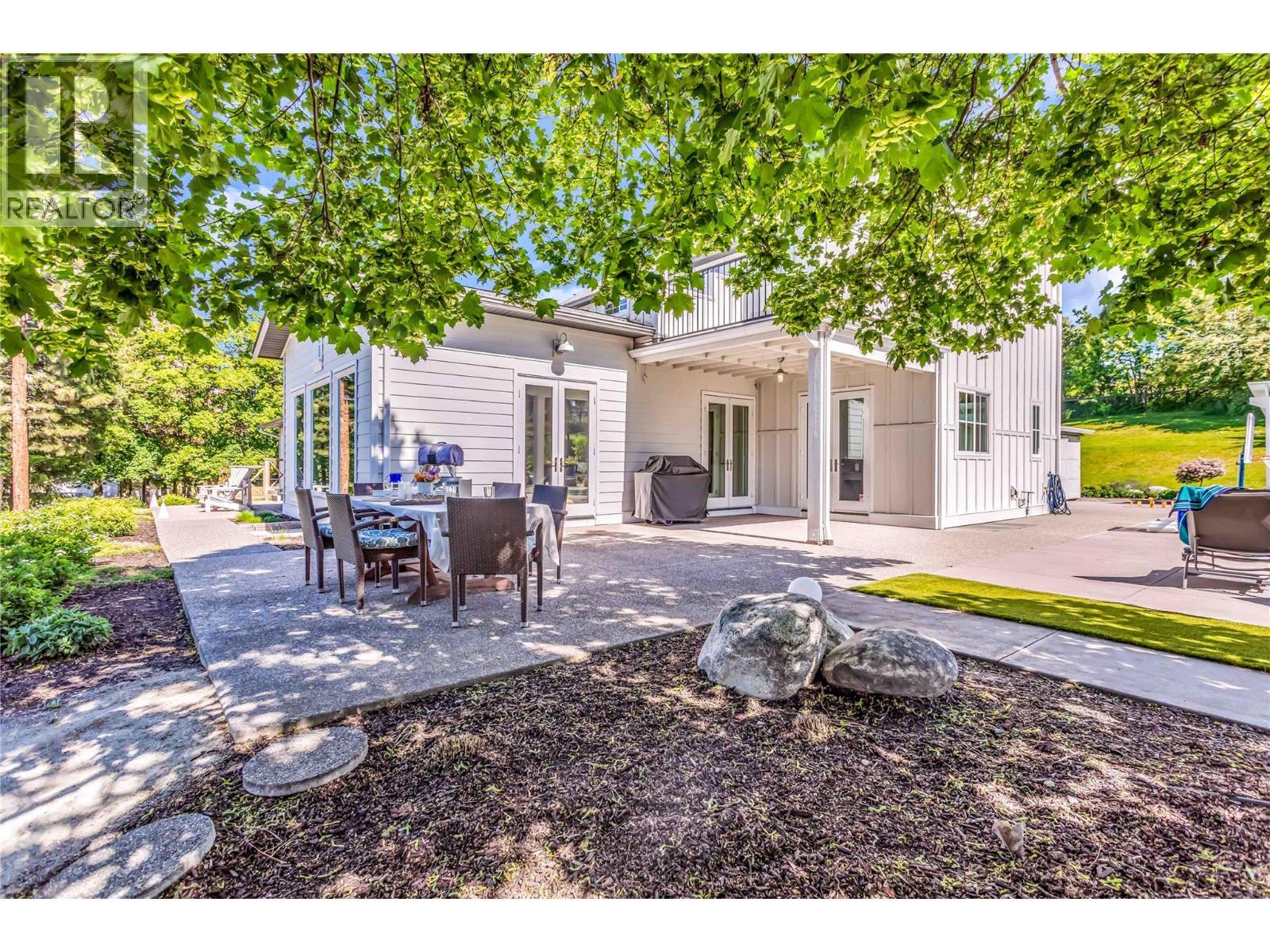 Patio off of the living room and kitchen - 2376 Saucier Road, Kelowna, BC - Outdoor With Deck Patio Veranda