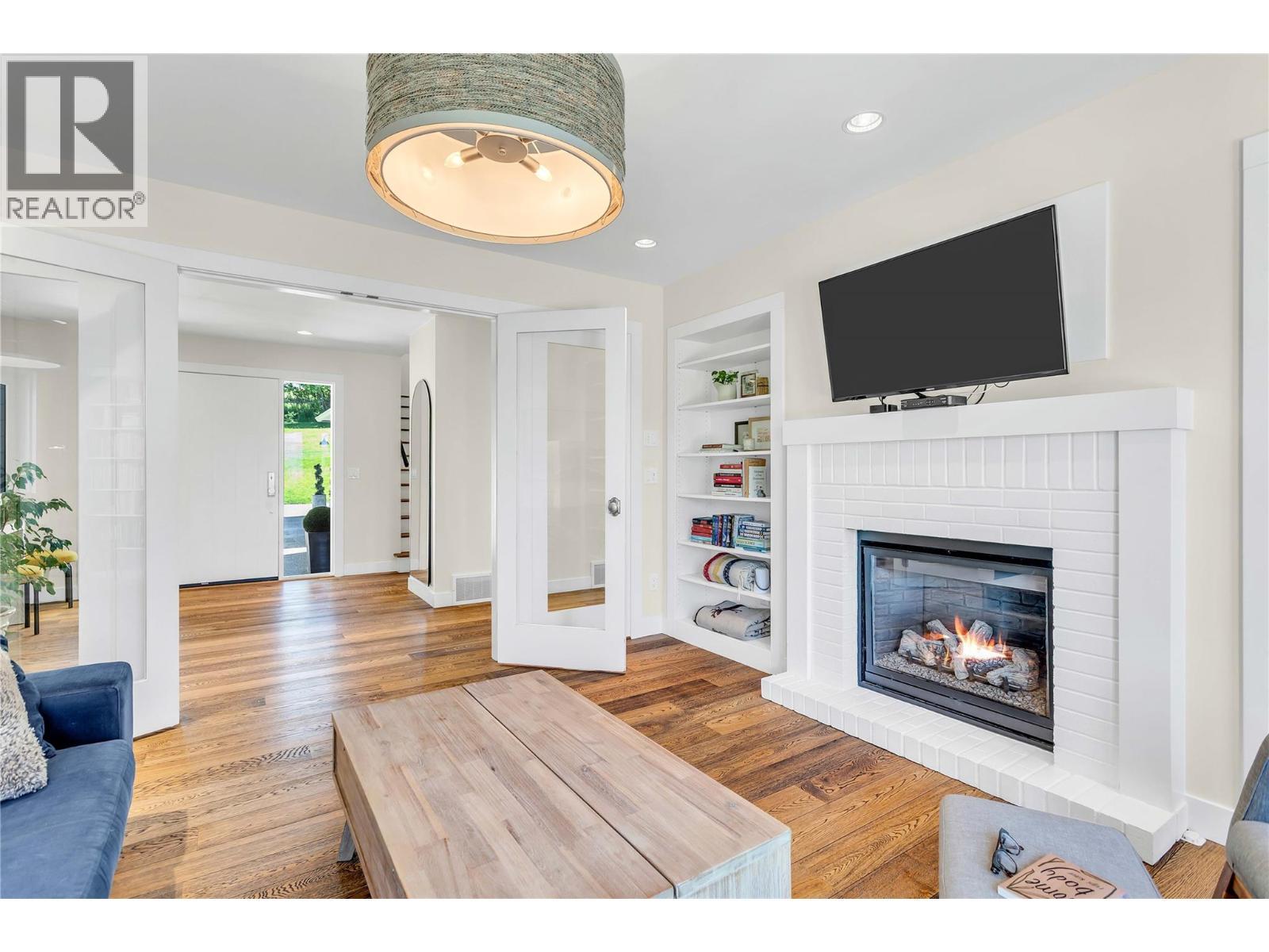 Spacious den to enjoy some R&R - 2376 Saucier Road, Kelowna, BC - Indoor Photo Showing Living Room With Fireplace