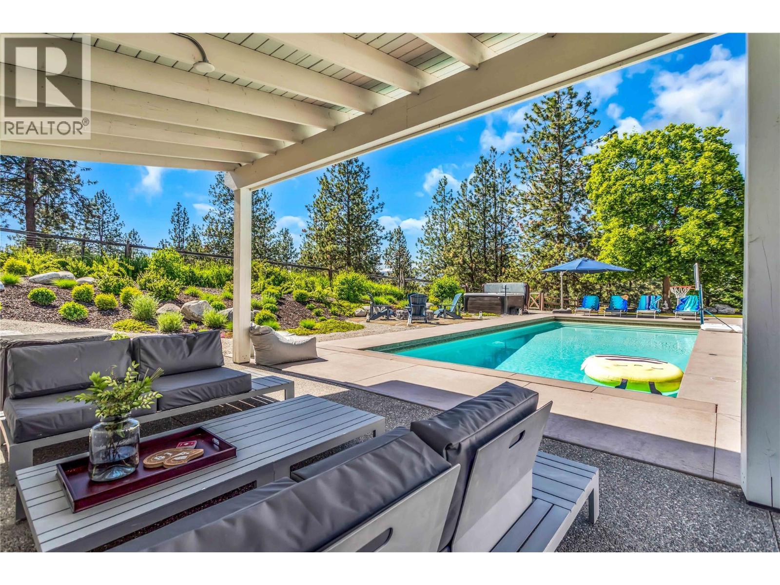 Covered outdoor living space - easy to entertain - 2376 Saucier Road, Kelowna, BC - Outdoor With In Ground Pool With Deck Patio Veranda