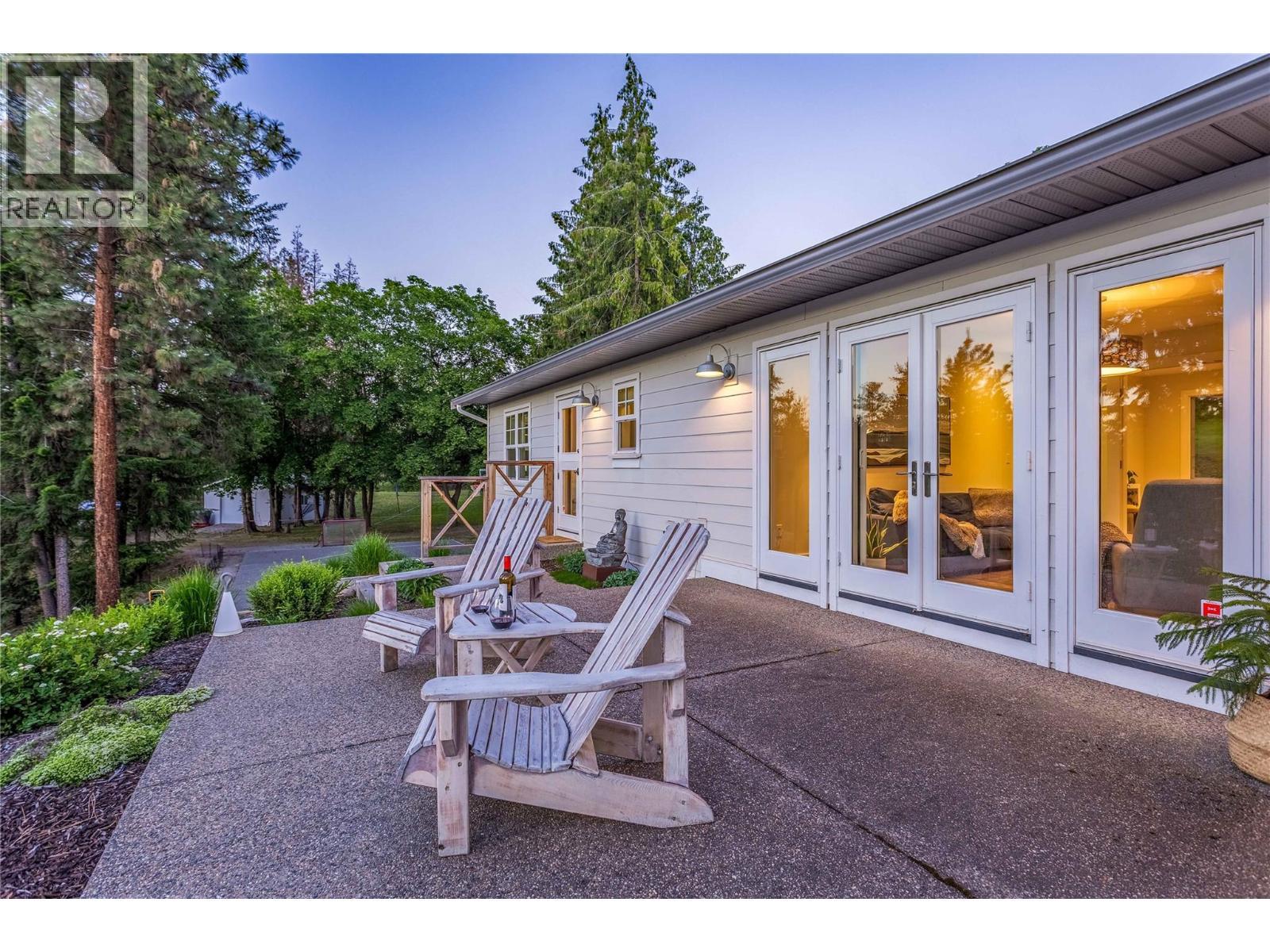 Easy flow from indoors to outdoors - 2376 Saucier Road, Kelowna, BC - Outdoor With Deck Patio Veranda With Exterior