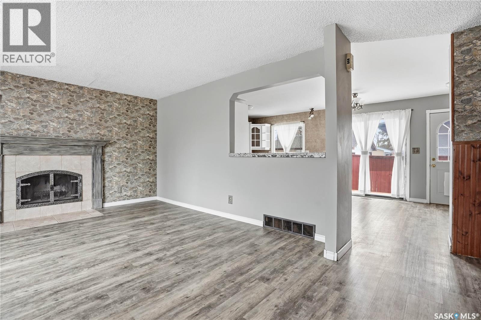 3 Carson Road, Regina, SK - Indoor Photo Showing Living Room With Fireplace