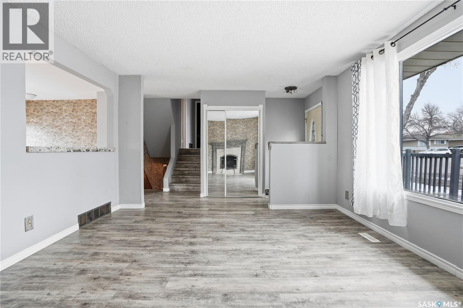 3 Carson Road, Regina, SK - Indoor Photo Showing Other Room With Fireplace